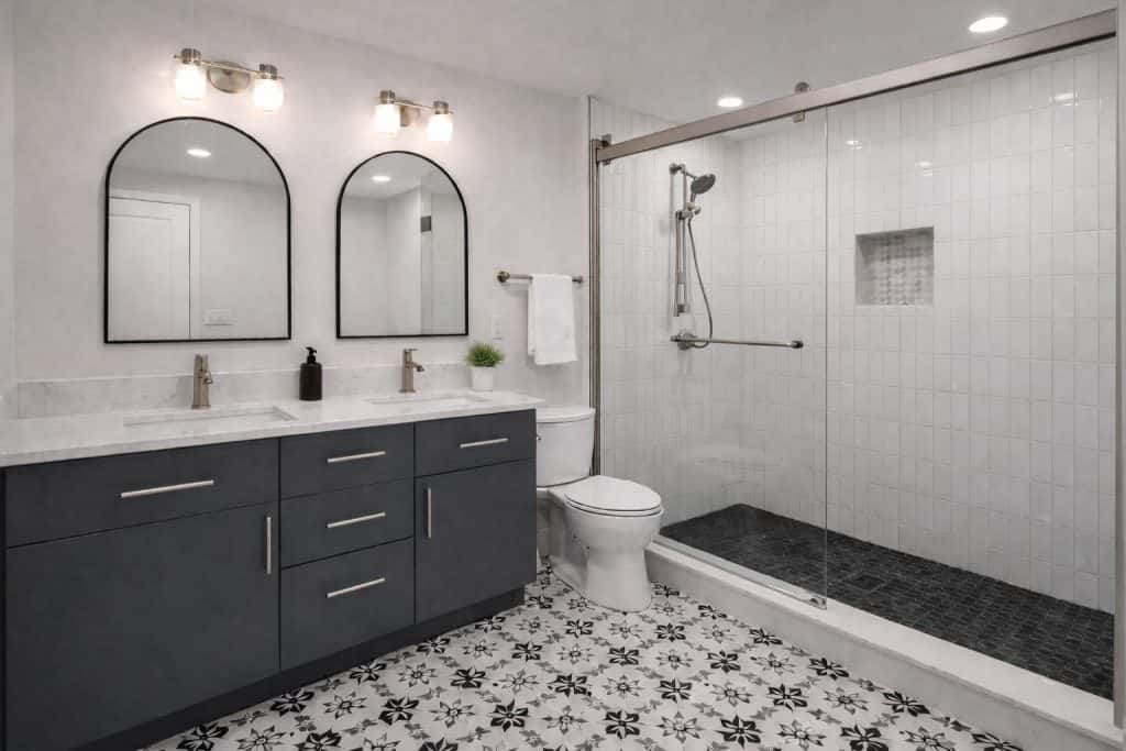 Remodeled bathroom with double vanity and glass shower