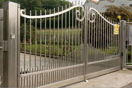 Arched metal driveway gate